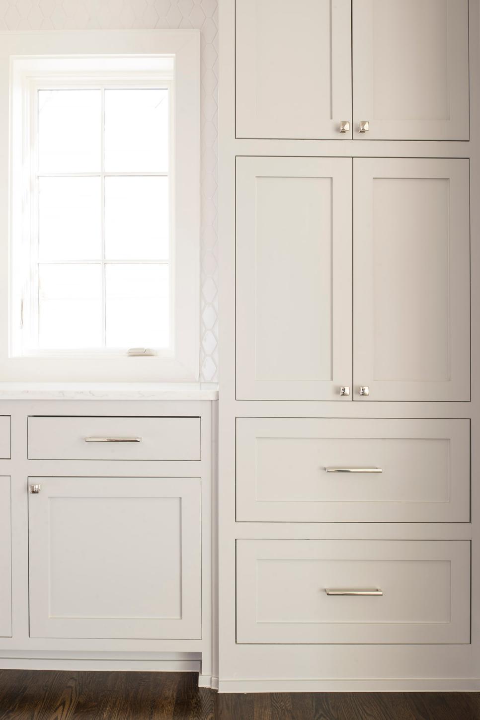 White Cabinets With Stainless Steel Knobs And Handles Built Into Transitional Kitchen Design Hgtv