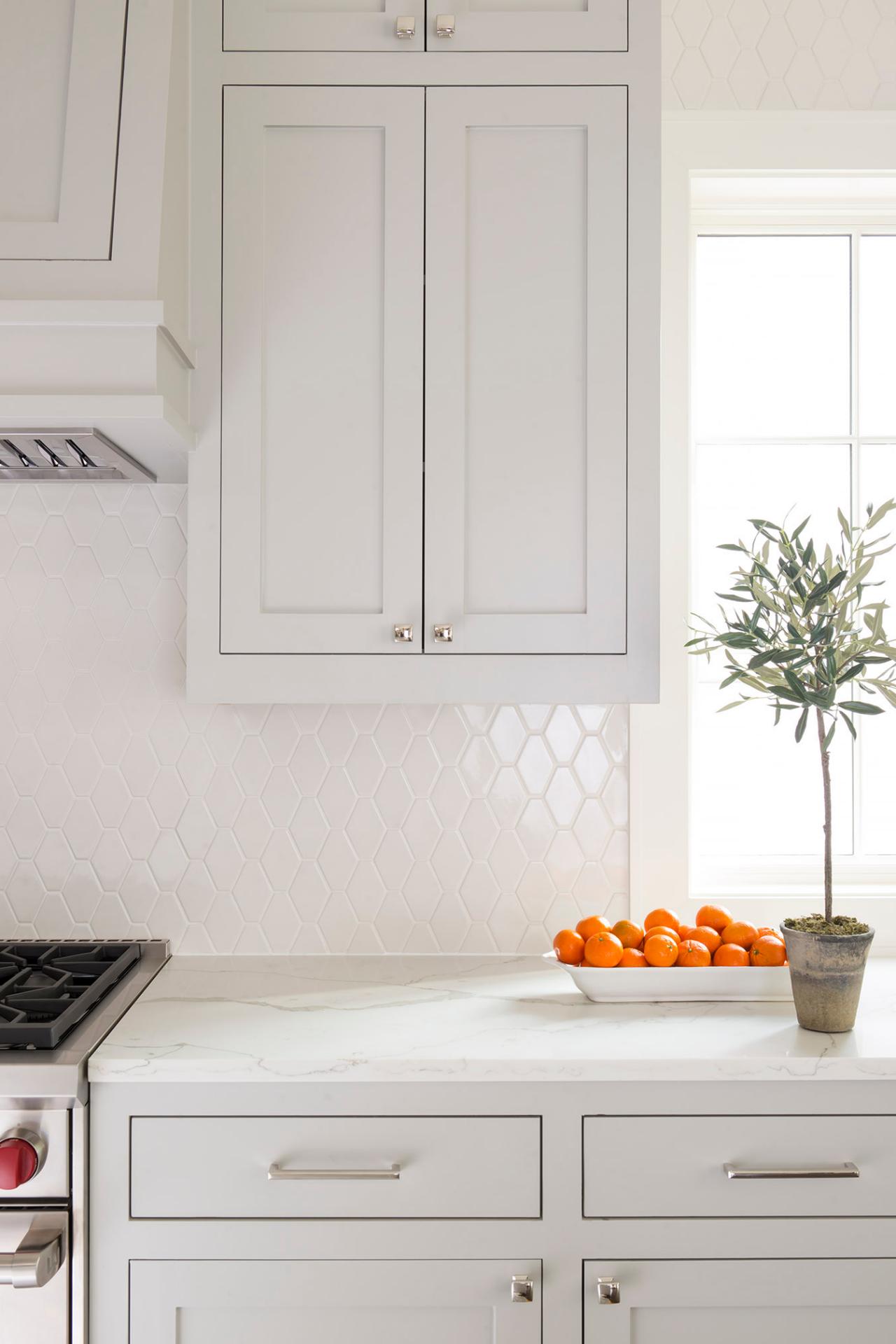 White Kitchen Quartz Countertop and Built in Cabinets Surrounding