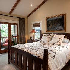 Craftsman Master Bedroom With White Floral Bed Linens, Dark Wood Bed Frame and Wood French Doors 