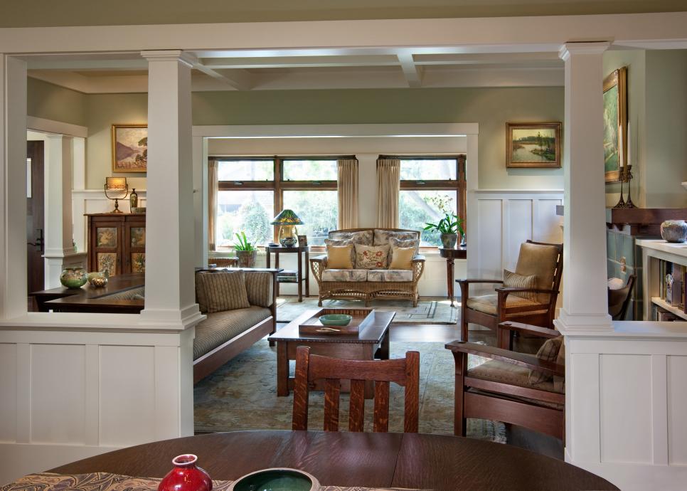 White Column Framed Doorway Leading From Dining Room To Craftsman Living Room With Wood Furniture Hgtv