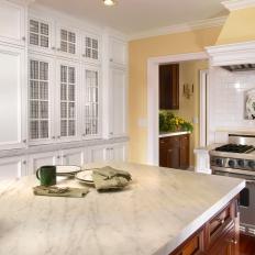 Yellow Cottage Kitchen With White Cabinets