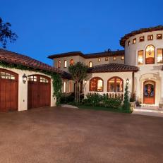 Italian Villa Front Entrance With Levels in Architecture, Shingled Roof and Wood Garage Doors 