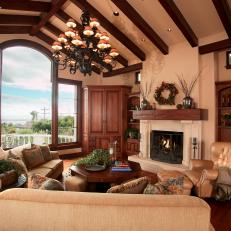 Grand Traditional Living Room With Large Windows, Neutral Sitting Furniture and Matching Built in Wood Cabinets 