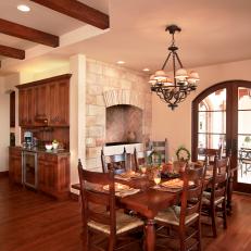 Open Traditional Dining Room With Wood Set Up Arched French Doors And Wrought Iron Chandelier Open Traditional Dining Room With Wood Set Up Arched French Doors And Wrought Iron Chandelier