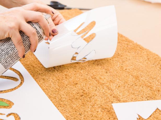 Lightly spray adhesive to the backside of your stencils, then press firmly into place. For smaller areas, like the interior of an “a” use masking tape rather than stencil paper to ensure clean edges. Trace the shape onto the tape, then cut it out.