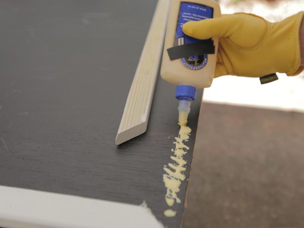 Secure the trim pieces to the front of the chalkboard using wood glue and screws. Drill through the back of the plywood, so there are no exposed screws on the front.