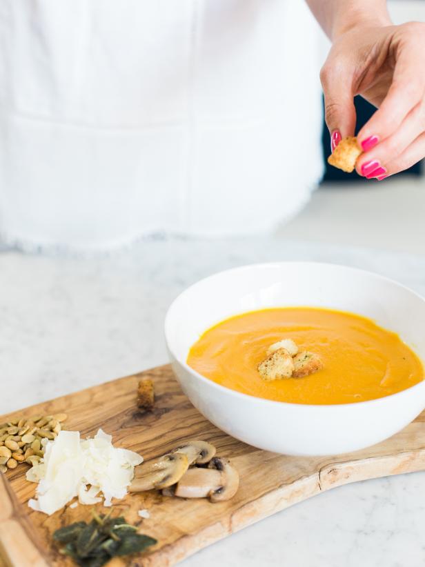 Adding Garnishes to Homemade Pumpkin Soup