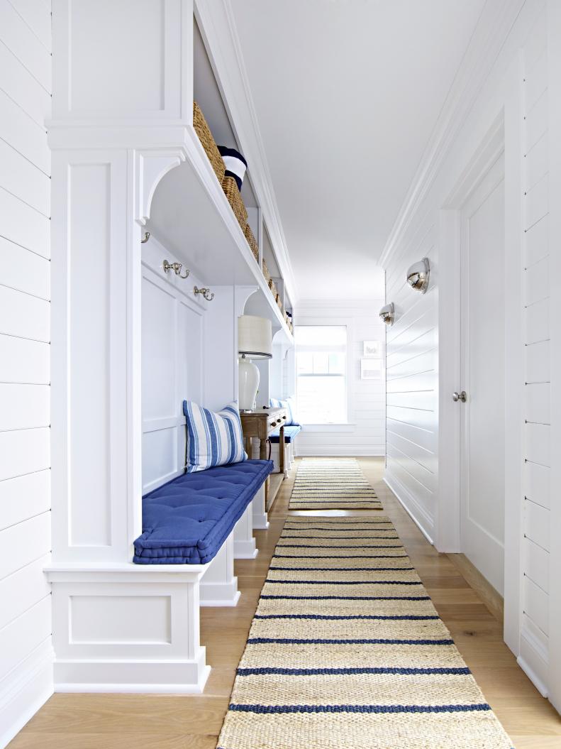 White Coastal Mudroom With Blue Accents and Striped Runners