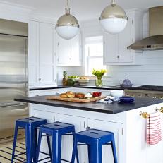 Bright, Eat-in Kitchen Features Bold, Blue Barstools