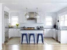White Coastal Kitchen With White Cabinets, Dark Blue Barstools