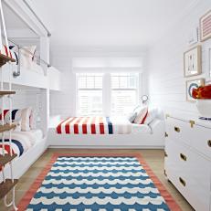 Bright, White Kids Bunk Room With Red and Blue Accents