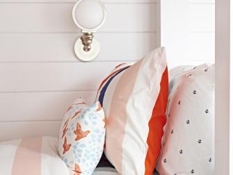 White Coastal Kids Bedroom With Red, White and Blue Bedding