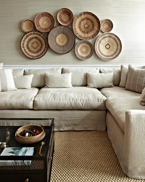 Basket Wall Art Above a Neutral Color Sectional