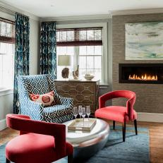 Blue and Brown Midcentury Sitting Room With Red Chairs