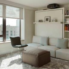 Media Room Triples as Office and Guest Bedroom with Stylish Murphy Bed