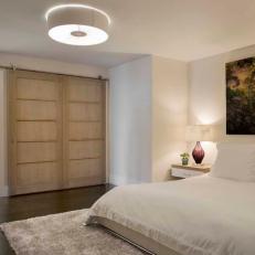 Modern Barn Door Separates Master Bedroom and Master En Suite