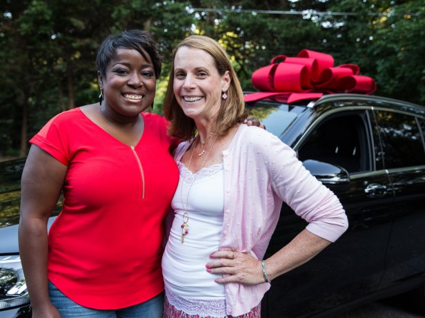 HGTV host Tiffany Brooks surprises Theresa Smith of Glenwood, Maryland, that she is the grand prize winner of the HGTV Smart Home 2016 located in Raleigh, NC.