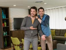 Hosts Drew and Jonathan Scott in the living room of the team Jonathan House, as seen on Brother vs. Brother. (portrait)