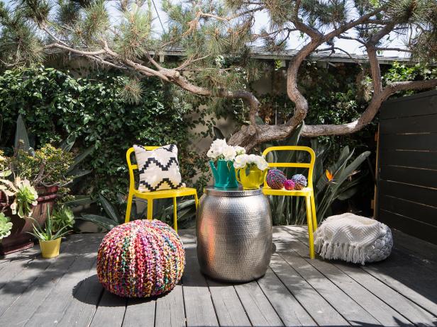 Eclectic Patio with Yellow Chairs, Multi-Colored Fabric Pouf Ottoman and Silver Garden Stool