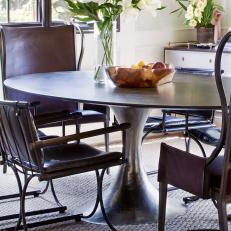 Dining Room Features Tulip Table & Brown Leather Chairs