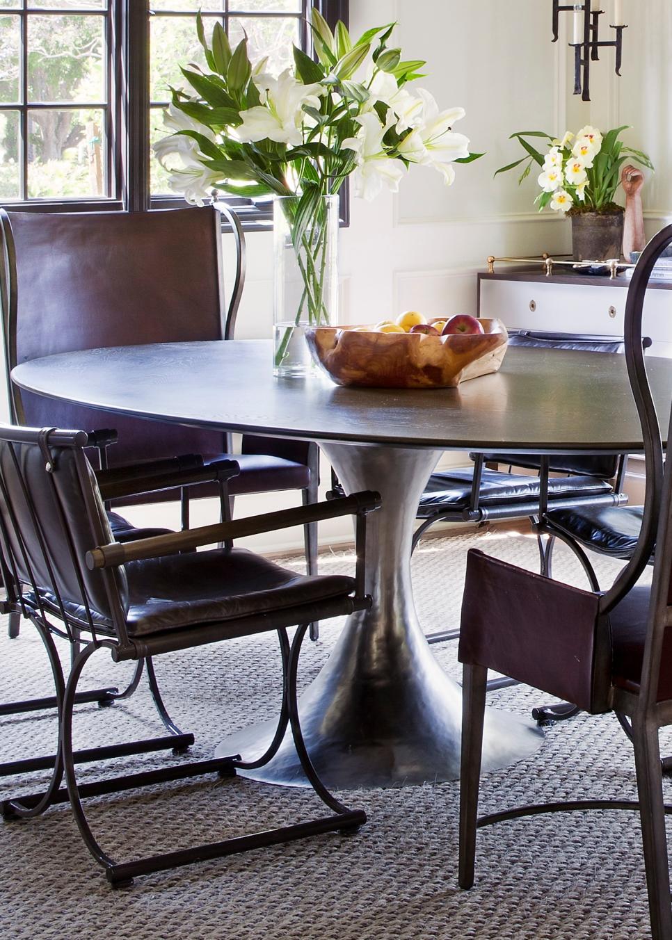 Dining Room Features Tulip Table & Brown Leather Chairs | HGTV