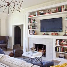 Cozy Living Room With Built-in Bookshelves and Fireplace