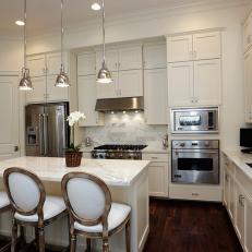 White Kitchen With Stainless Appliances