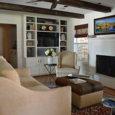 Masculine Living Room with Exposed Beams and Neutral Color Palette