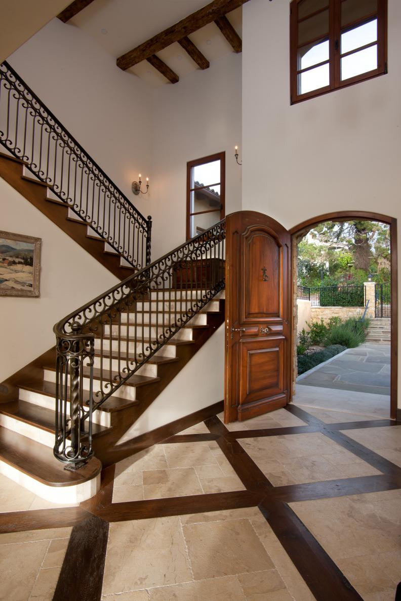 French Country Foyer With Stairs, Tile-and-Hardwood Floor