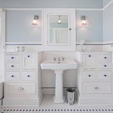 Blue and White Bathroom With Blue Pulls