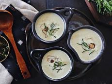 Creamy leek soup gets a healthy makeover with Greek yogurt and fried rosemary sprigs. 