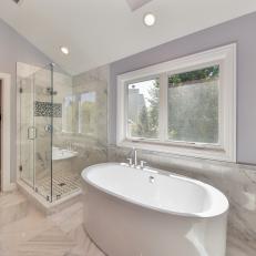Contemporary Gray Bathroom With White Free Standing Bathtub, Glass Shower and Marble Floor Tile