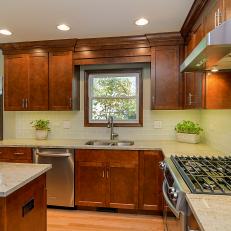 Timeless Kitchen Features Warm Wood Cabinets and Granite Countertops