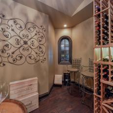 Wine Cellar With Wooden Bottle Racks, Wrought Iron Wall Art and Wood Wine Boxes for Decor 
