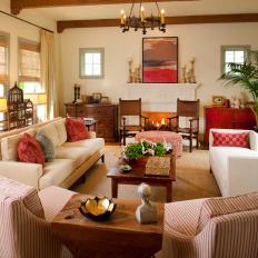 Neutral Contemporary Living Room with Warm, Red Accent Pieces