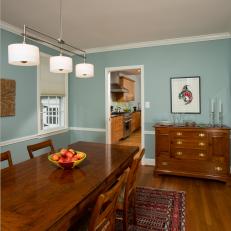 Blue Traditional Dining Room With Red Rug