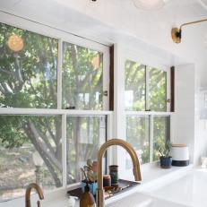 Brass Sconces and White Subway Tile Add Style to Kitchen