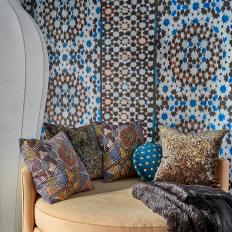 Brown Chaise and Bold Patterned Wallpaper