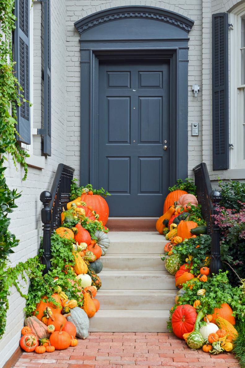 Front entry decorated with pumpkins and gourds for Fall