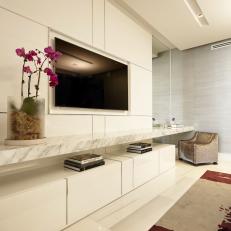 TV With White Cabinets and Marble Counter