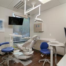 Modern Dental Office With Blue Examination Chairs