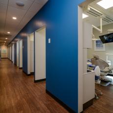 Contemporary Dental Office With Bold Blue Hall