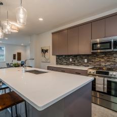 Contemporary Eat-In Kitchen With Mosaic Tile Backsplash