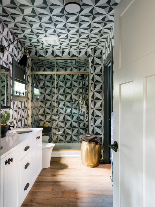 Bathroom With Geometric-Pattern Tiled Wall and Ceiling