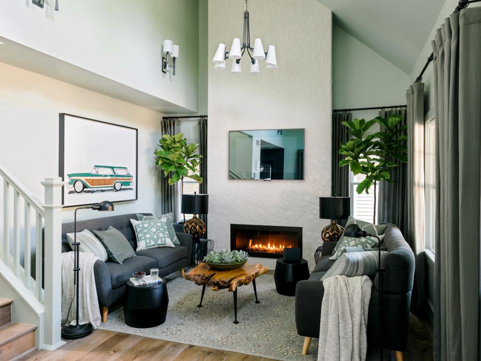 Gray-Green Living Room With Tall Ceilings, White Fireplace