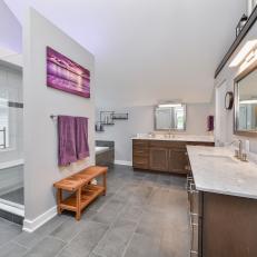 Spacious, Gray Main Bathroom With Pops of Purple