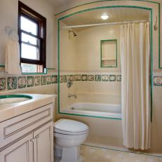 Neutral Guest Bathroom with Teal Spanish Tile Accents