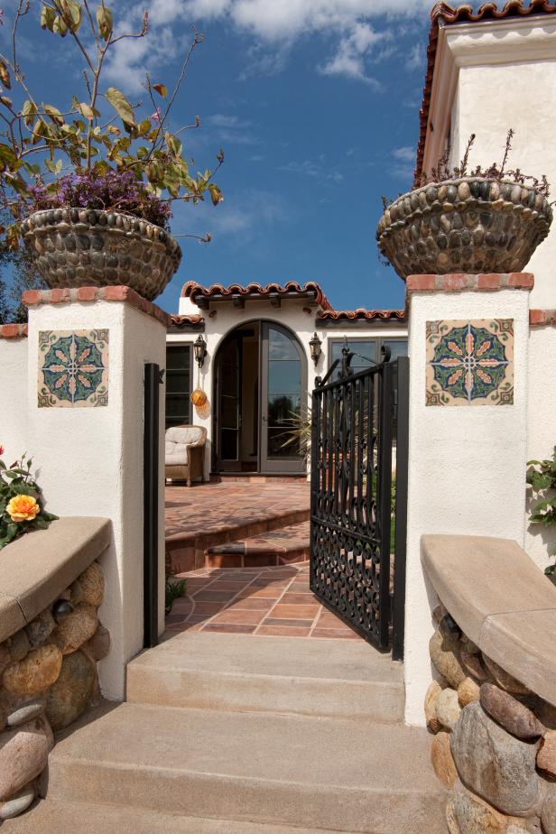 Brick and Stucco Fence Keeps Spanish Colonial Patio Private | HGTV