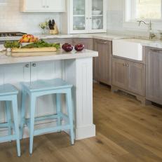 Transitional Kitchen With Farmhouse Sink and Light Blue Stools