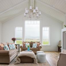 Transitional Living Room With Large Windows and White Vaulted Ceiling